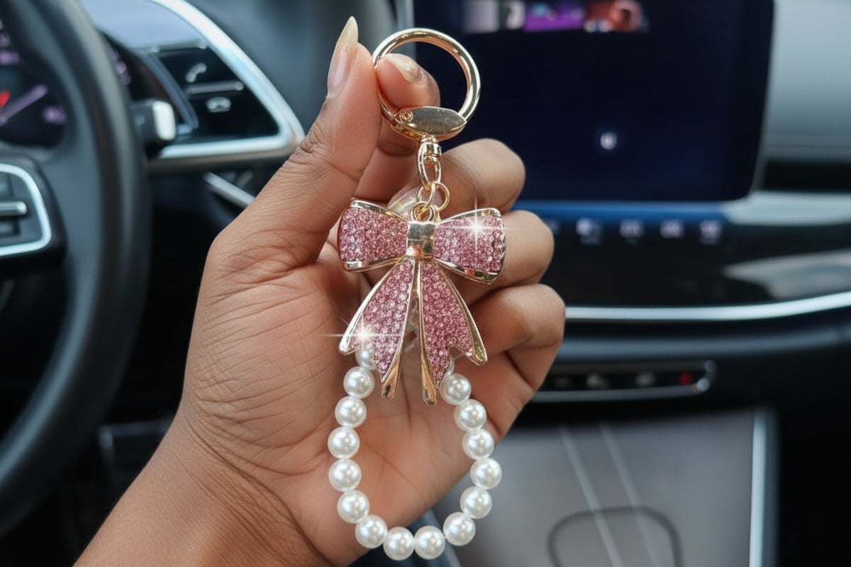 Enchanting faux pearl and rhinestone bow keychain.