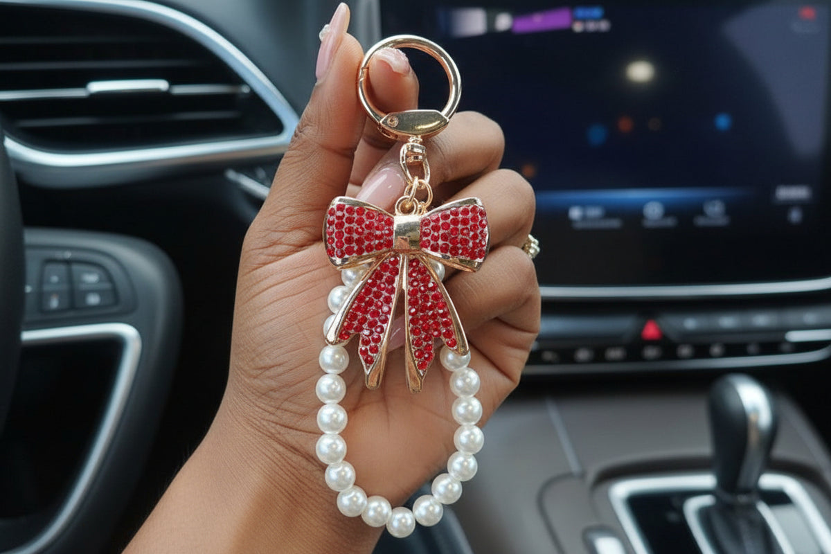 Enchanting faux pearl and rhinestone bow keychain.
