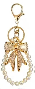 Enchanting faux pearl and rhinestone bow keychain.