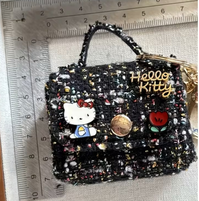 Hello Kitty plush checkered twill mini bag keychain.